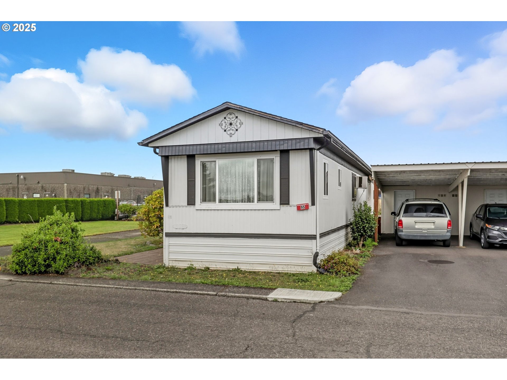 300 Southwest 7th Avenue, Unit 95 Battle Ground, WA 98604 - Photo 27 of 27 a front view of a house with a yard