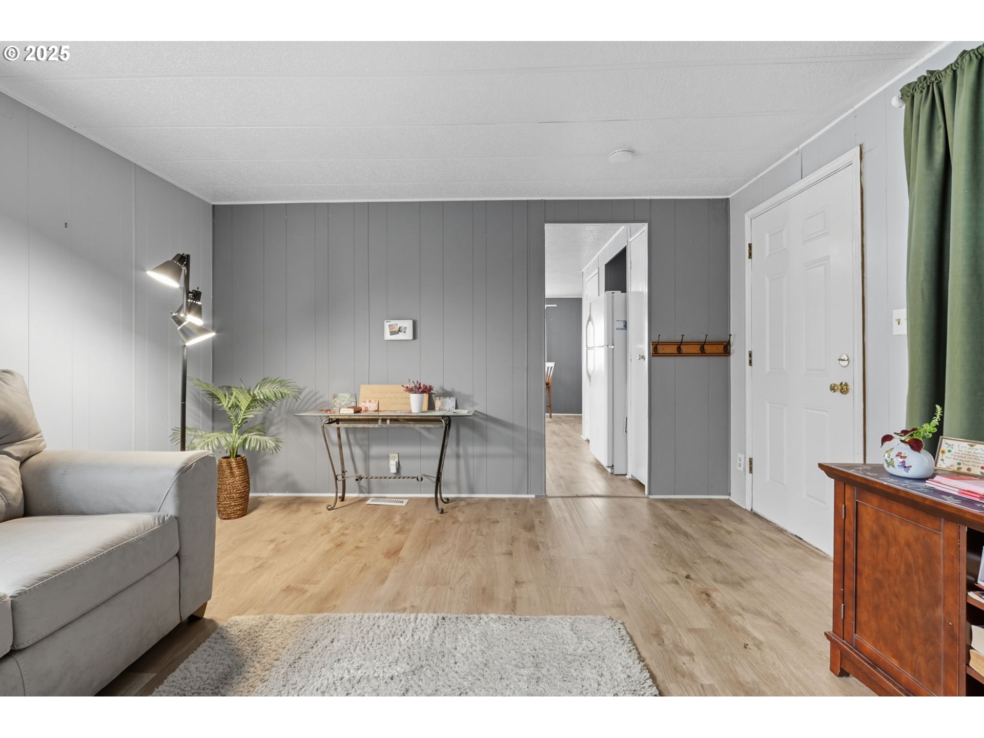 300 Southwest 7th Avenue, Unit 95 Battle Ground, WA 98604 - Photo 7 of 27 a living room with furniture and a flat screen tv