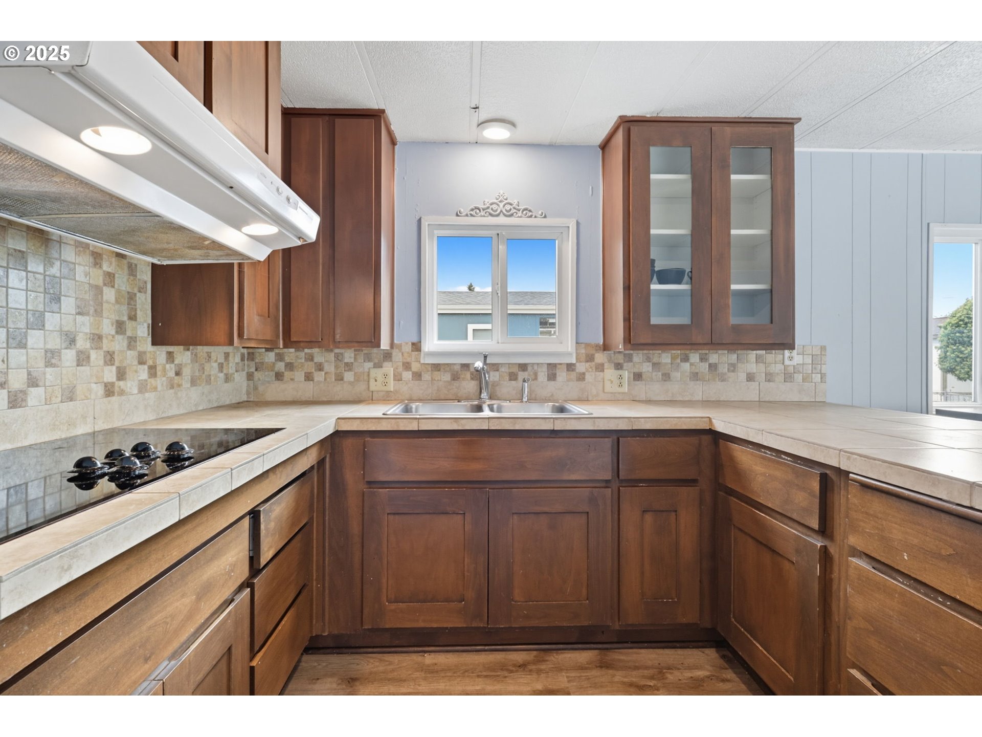 300 Southwest 7th Avenue, Unit 95 Battle Ground, WA 98604 - Photo 8 of 27 a kitchen with sink cabinets and window