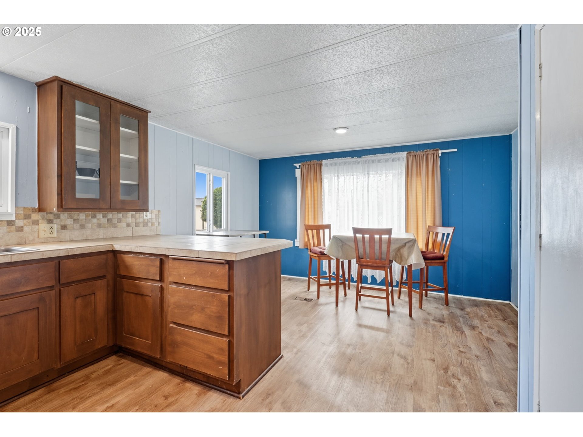 300 Southwest 7th Avenue, Unit 95 Battle Ground, WA 98604 - Photo 10 of 27 a kitchen with granite countertop sink cabinets and appliances