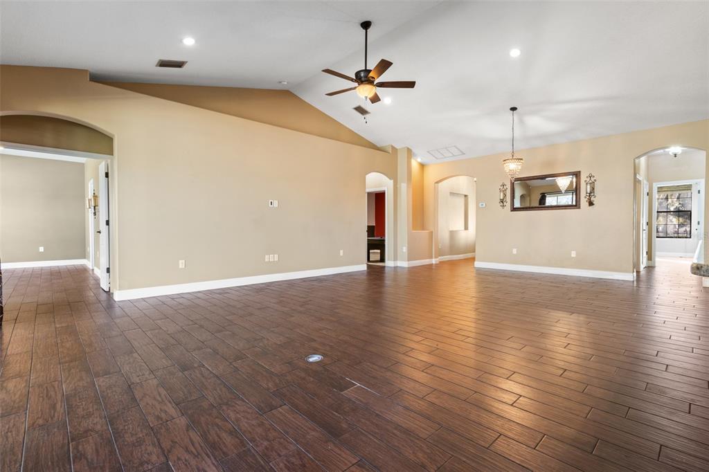 765 Sloans Ridge Road Groveland, FL 34736 - Photo 27 of 62 wooden floor in an empty room with a window