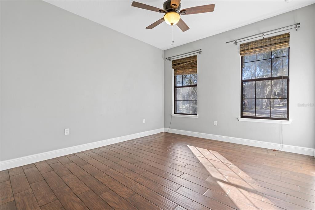 765 Sloans Ridge Road Groveland, FL 34736 - Photo 30 of 62 wooden floor in an empty room with a window