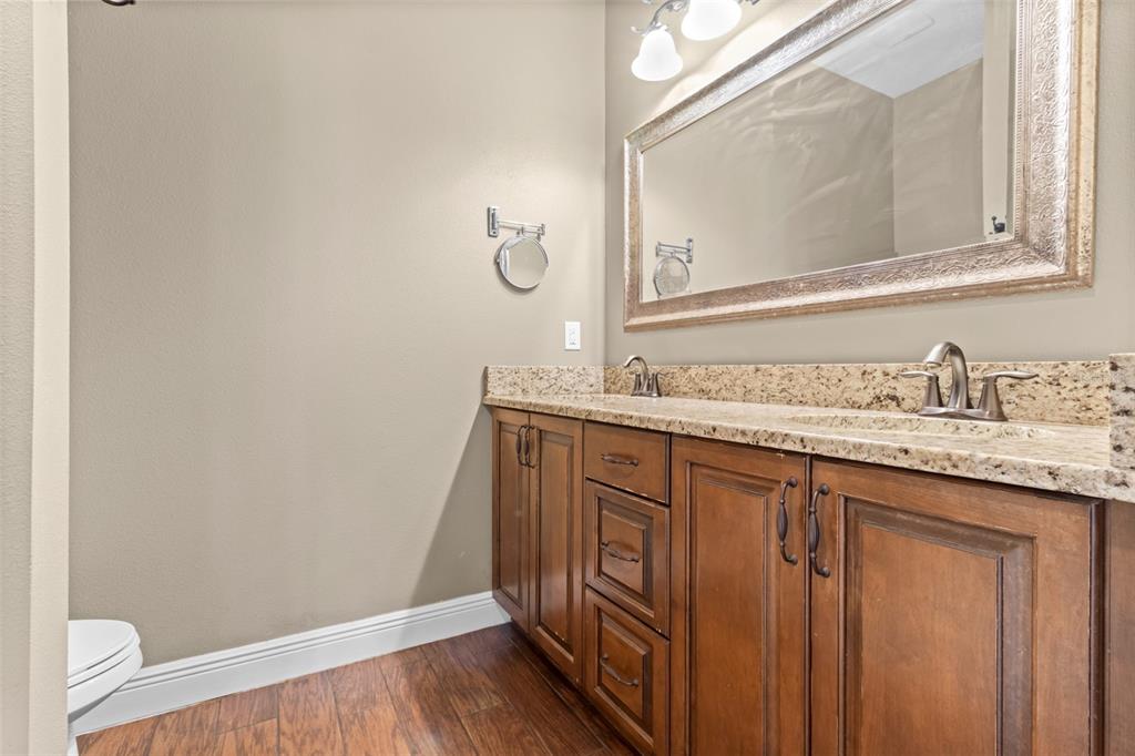 765 Sloans Ridge Road Groveland, FL 34736 - Photo 32 of 62 a bathroom with a sink and a mirror