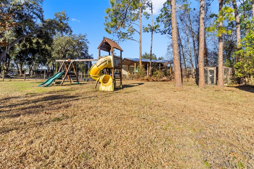 765 Sloans Ridge Road Groveland, FL 34736 - Photo 42 of 62 a view of a park with slide