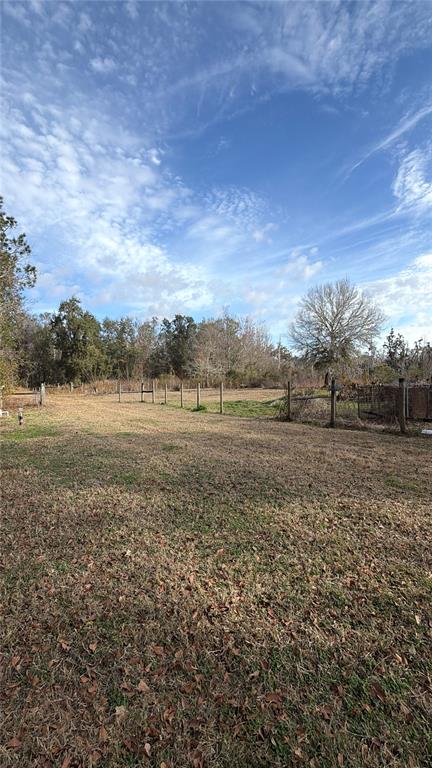 765 Sloans Ridge Road Groveland, FL 34736 - Photo 52 of 62 a view of dirt field with trees