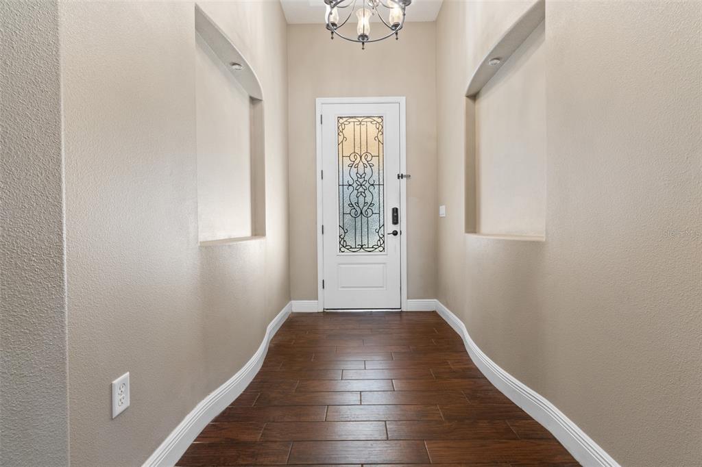 765 Sloans Ridge Road Groveland, FL 34736 - Photo 6 of 62 a view of an entryway with wooden floor