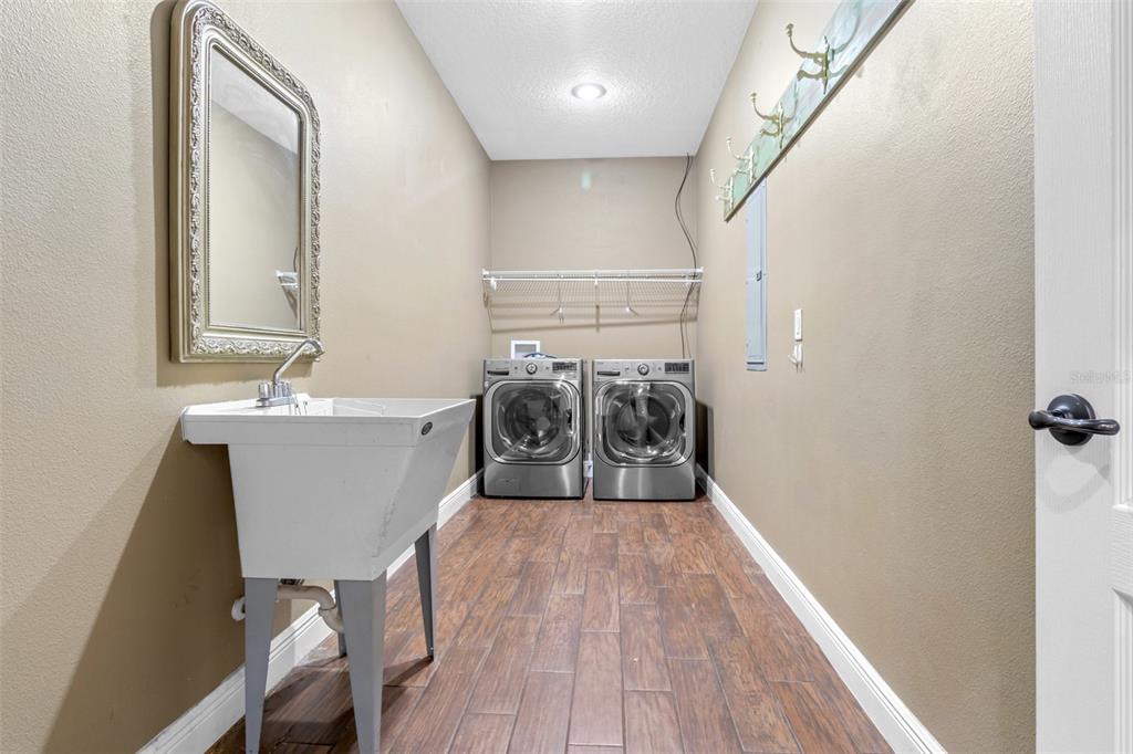 765 Sloans Ridge Road Groveland, FL 34736 - Photo 10 of 62 a bathroom with a sink and a mirror