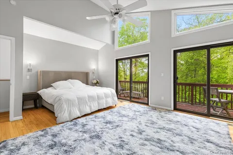 a bedroom with a large bed and a large window