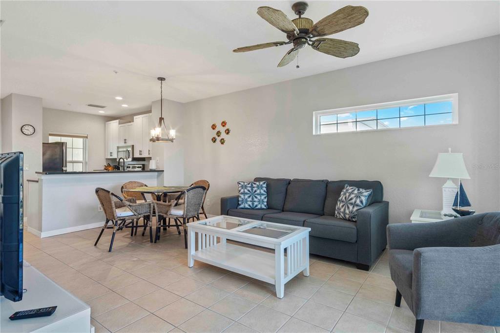 8409 Placida Road, Unit 405 Placida, FL 33946 - Photo 18 of 77 a living room with furniture kitchen view and a chandelier
