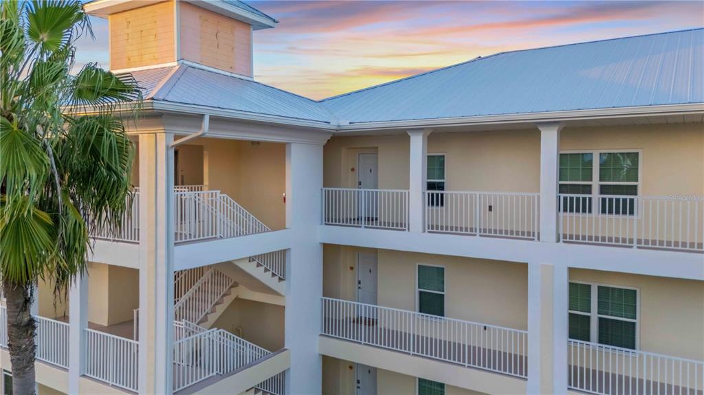 8409 Placida Road, Unit 405 Placida, FL 33946 - Photo 2 of 77 a view of a house with a iron gate