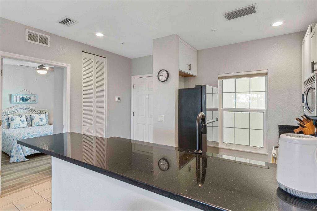 8409 Placida Road, Unit 405 Placida, FL 33946 - Photo 25 of 77 a view of a kitchen with a sink furniture and a window
