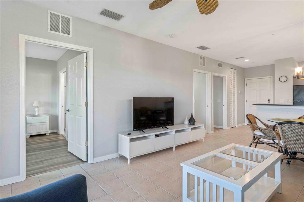 8409 Placida Road, Unit 405 Placida, FL 33946 - Photo 32 of 77 a living room with furniture and a flat screen tv
