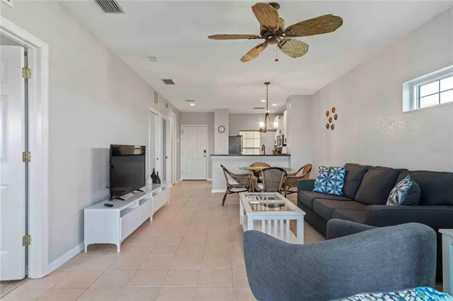 a bathroom with a granite countertop toilet a sink and a mirror