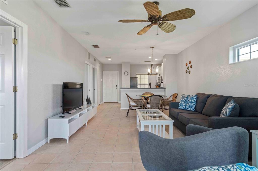 8409 Placida Road, Unit 405 Placida, FL 33946 - Photo 34 of 77 a living room with furniture and a flat screen tv