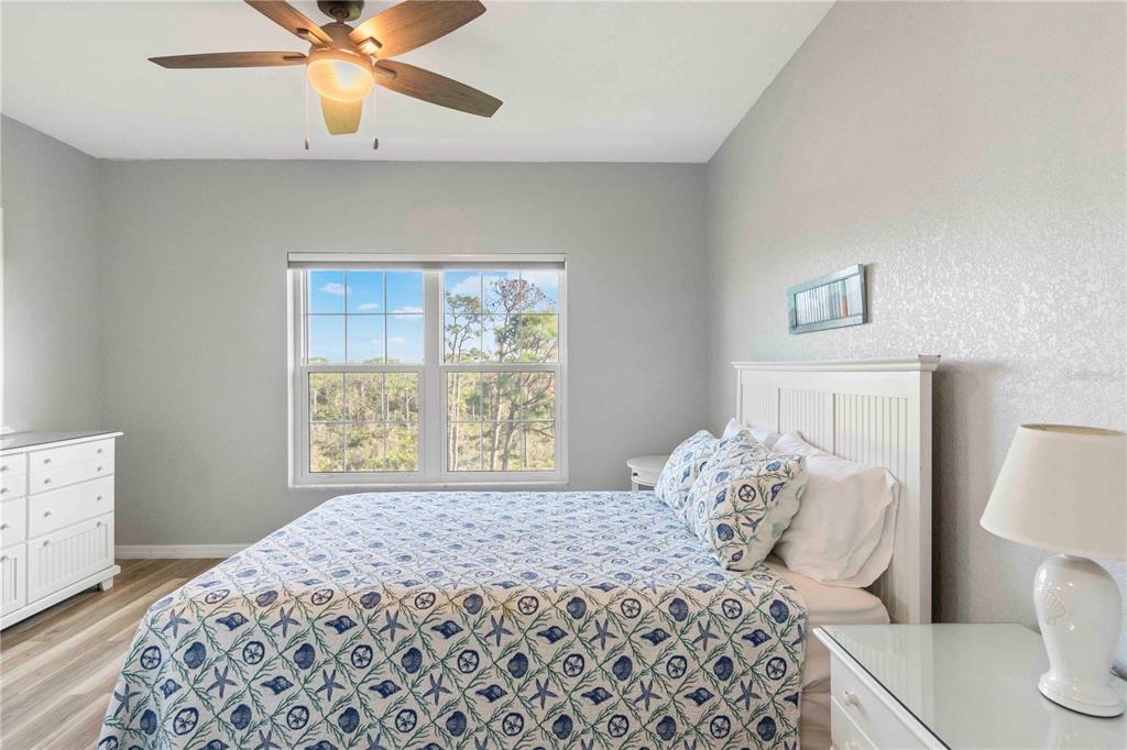 8409 Placida Road, Unit 405 Placida, FL 33946 - Photo 38 of 77 a bedroom with a large bed and a window