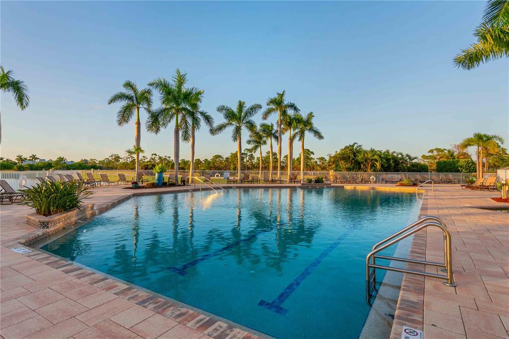 8409 Placida Road, Unit 405 Placida, FL 33946 - Photo 58 of 77 a view of a lake with a palm tree