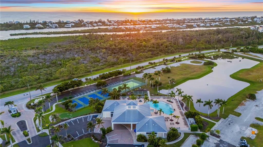 8409 Placida Road, Unit 405 Placida, FL 33946 - Photo 71 of 77 an aerial view of lake and residential houses with outdoor space