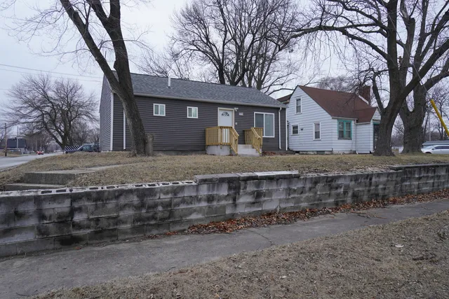 a front view of a house with trees