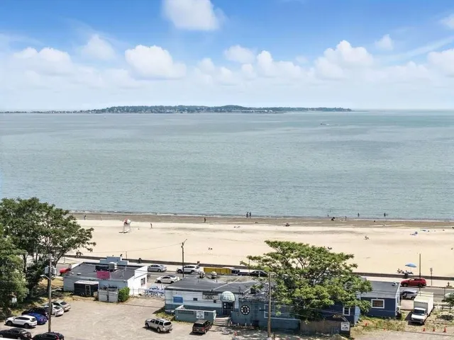 a view of a city and ocean