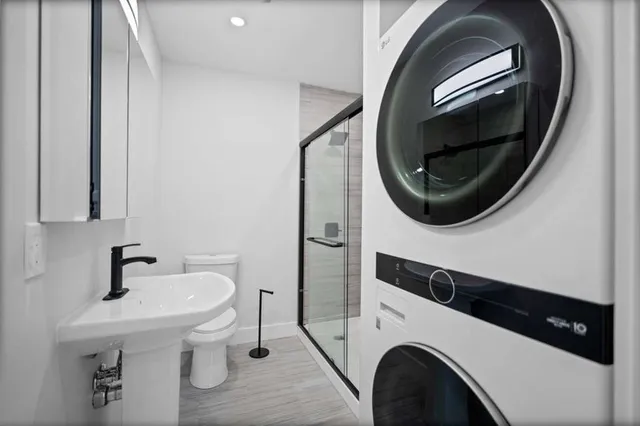 a bathroom with a sink and shower