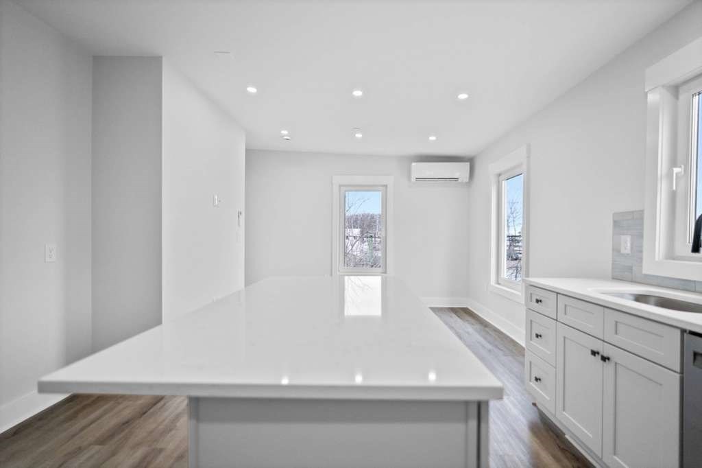 6 Garfield Avenue Revere, MA 02151 - Photo 23 of 29 a view of an empty room with wooden floor and a window