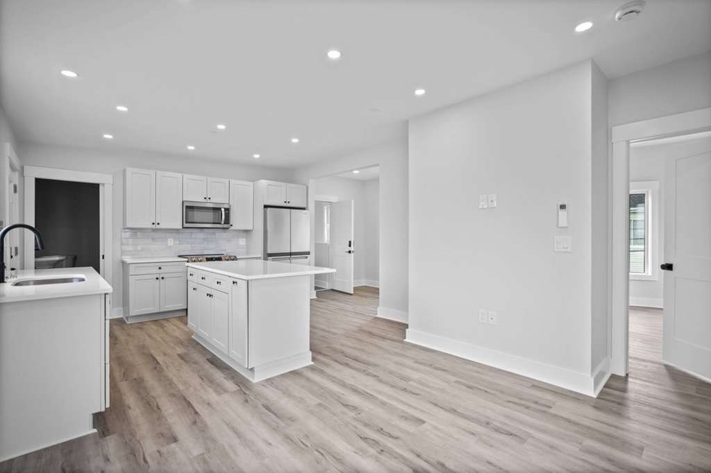 6 Garfield Avenue Revere, MA 02151 - Photo 26 of 29 a kitchen with white cabinets and stainless steel appliances