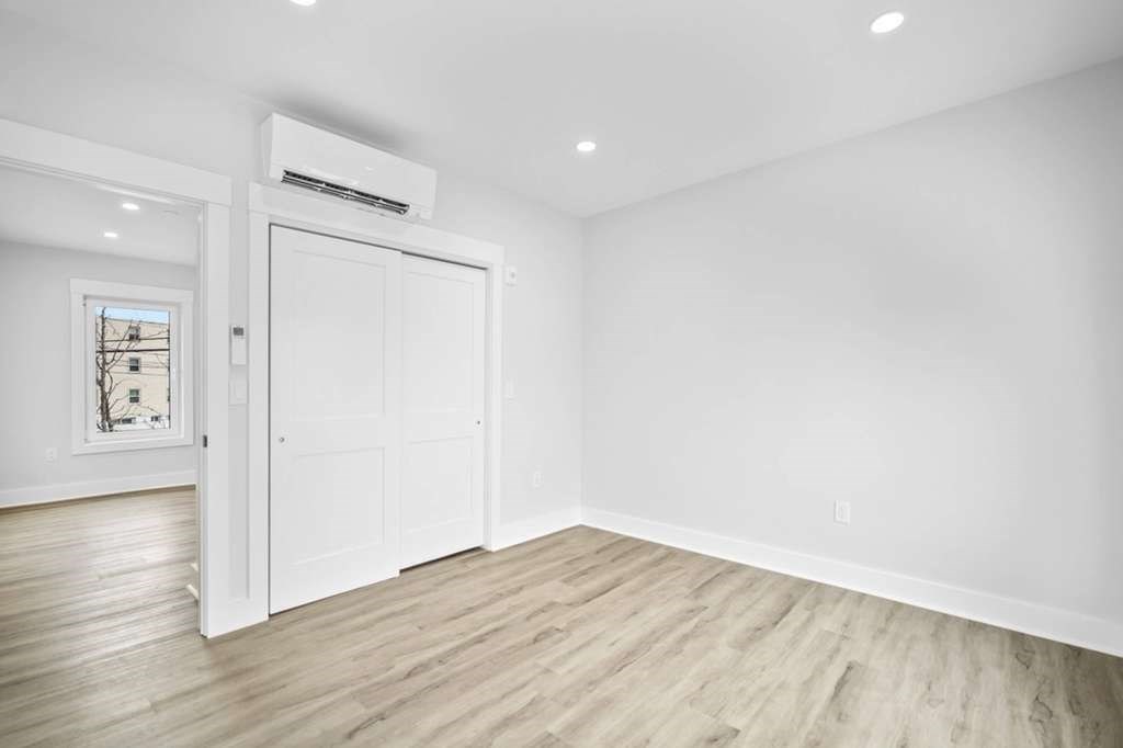 6 Garfield Avenue Revere, MA 02151 - Photo 28 of 29 a view of an empty room with wooden floor