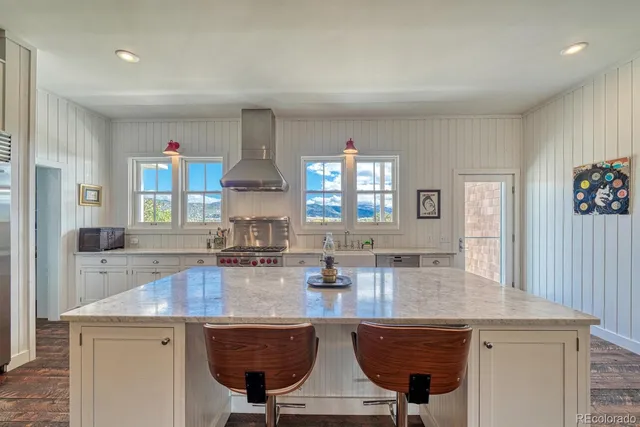 a kitchen with counter top space cabinets and stainless steel appliances