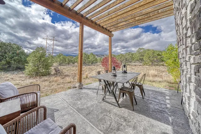 a view of an outdoor sitting area with furniture
