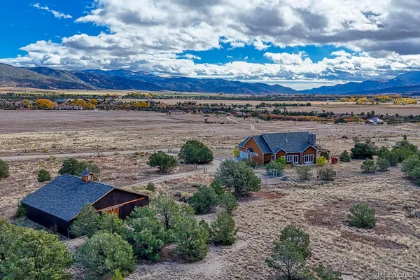 an aerial view of a house with a garden