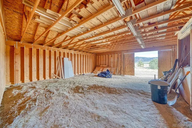 a view of a room with wooden walls