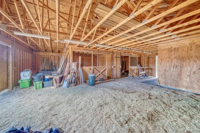 a view of a room with wooden walls