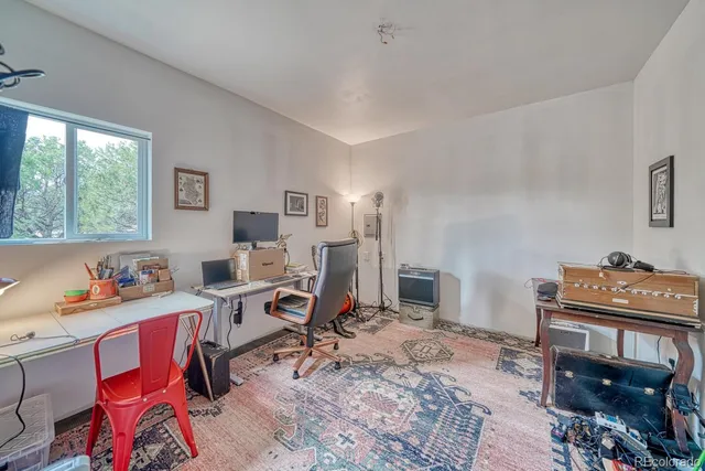 a workspace with furniture hardwood and a window