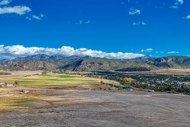a view of a lake with a house in the background