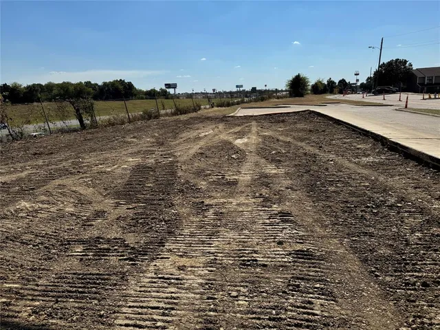 a view of a street with cars