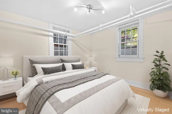 a bedroom with bed and a window