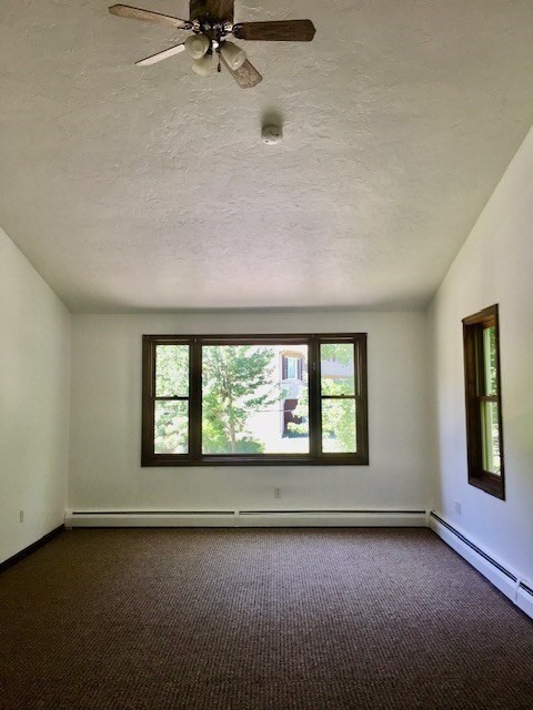 147 East County Road Rutland, MA 01543 - Photo 8 of 17 an empty room with a empty space and windows