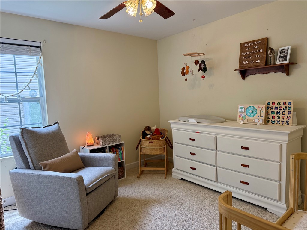 123 Abigail Lane Anderson, SC 29621 - Photo 12 of 22 This cozy room features soft carpeting and ample natural light, creating a serene environment.