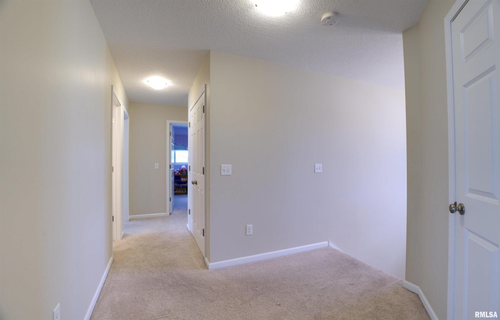 1917 11th Street Camanche, IA 52730 - Photo 23 of 40 a view of hallway with bathroom