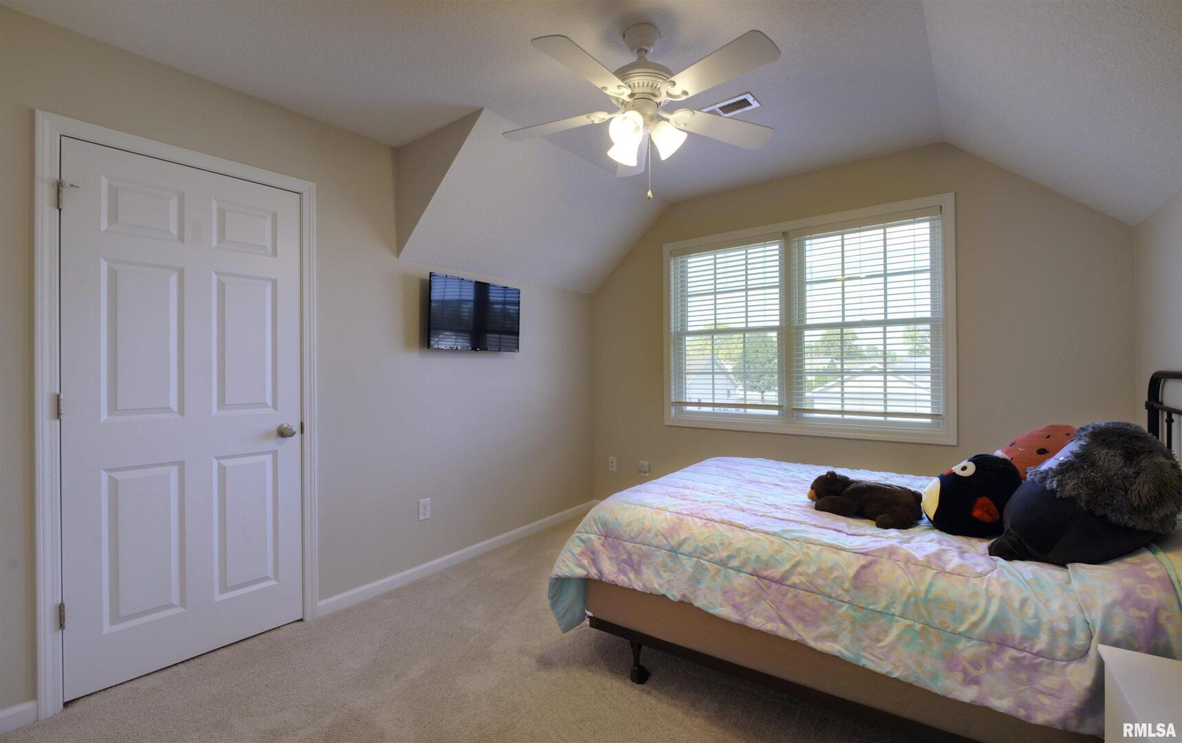 1917 11th Street Camanche, IA 52730 - Photo 29 of 40 a bedroom with a bed dresser and a window