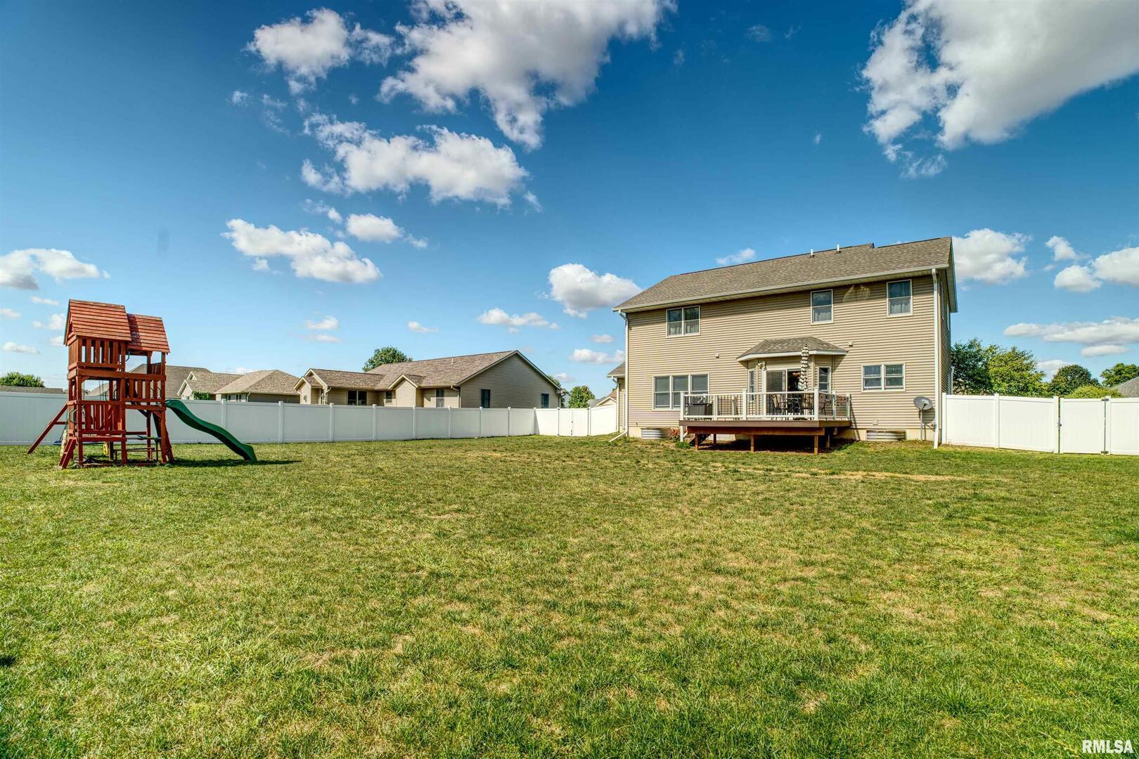 1917 11th Street Camanche, IA 52730 - Photo 39 of 40 a house view with a garden space