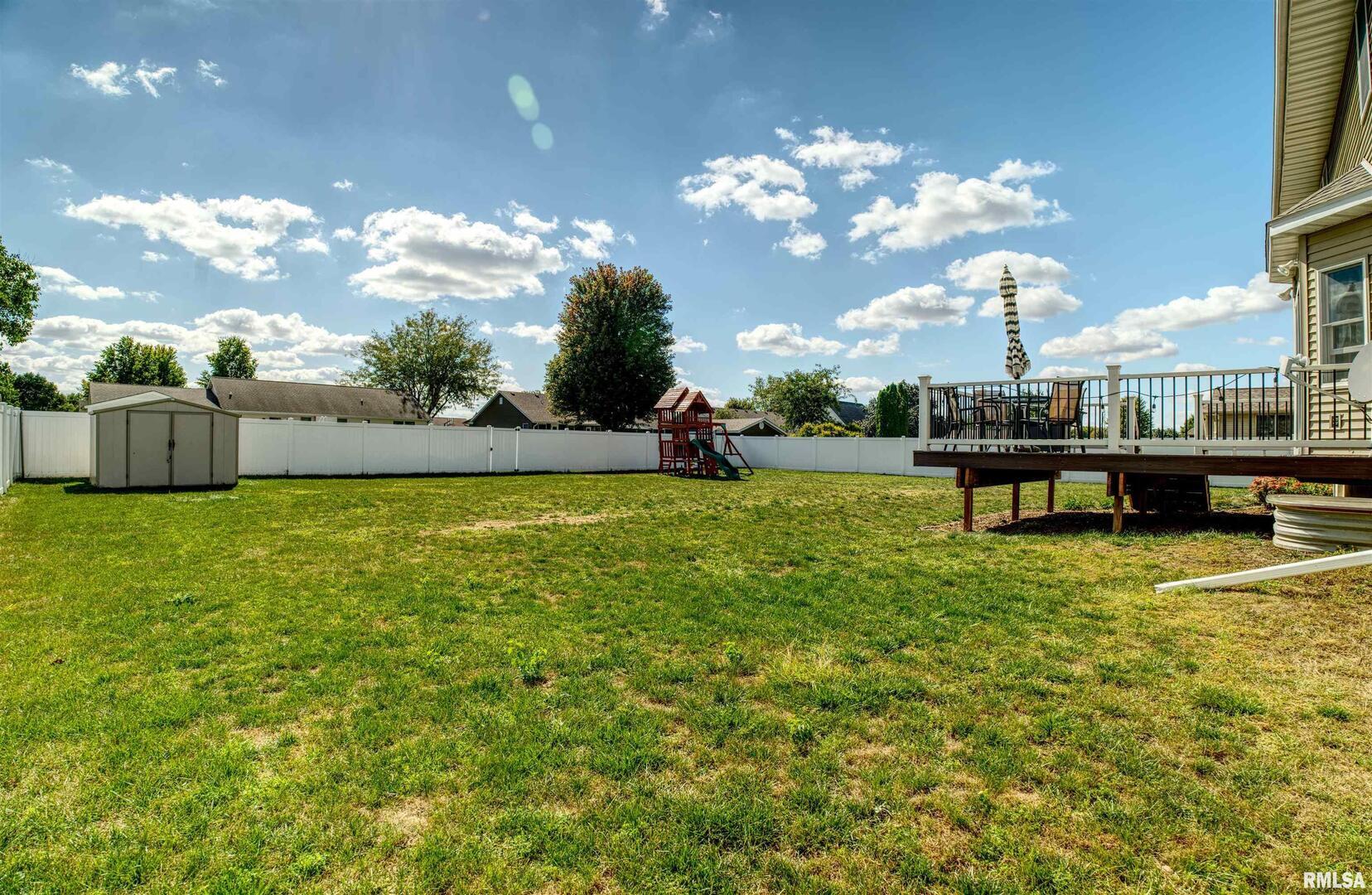 1917 11th Street Camanche, IA 52730 - Photo 40 of 40 a view of a house with a big yard