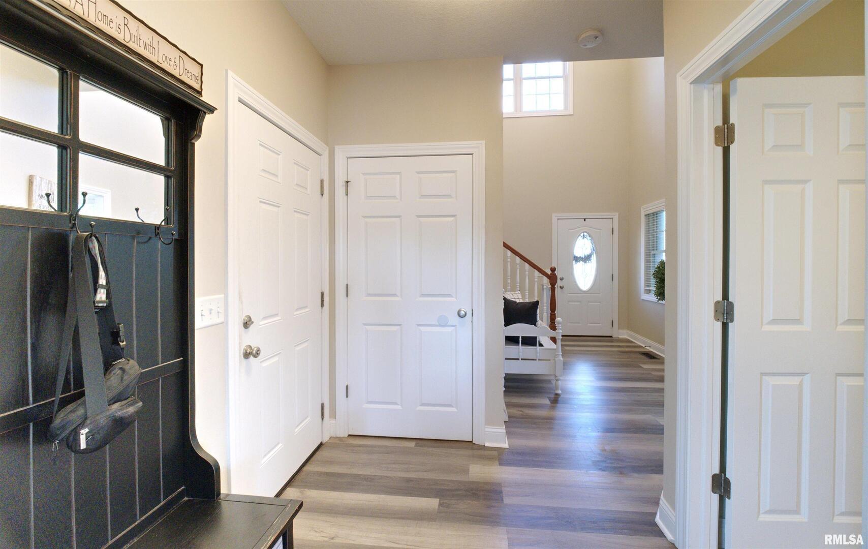 1917 11th Street Camanche, IA 52730 - Photo 5 of 40 a view of entryway with livingroom and wooden floor
