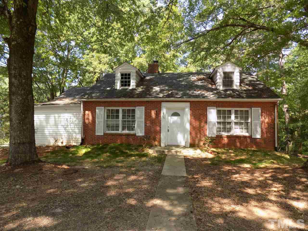 1114 Kent Road Raleigh, NC 27606 - Photo 1 of 10 a front view of a house with a yard