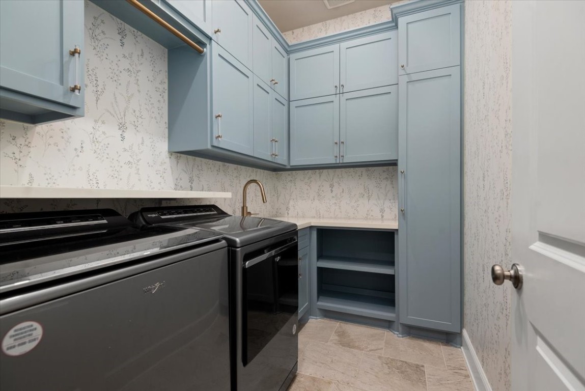 155 Rockwell Park Spring, TX 77389 - Photo 23 of 50 This beautifully designed utility room combines functionality and style, featuring sleek appliances, ample cabinetry, and elegant finishes for an efficient household experience.