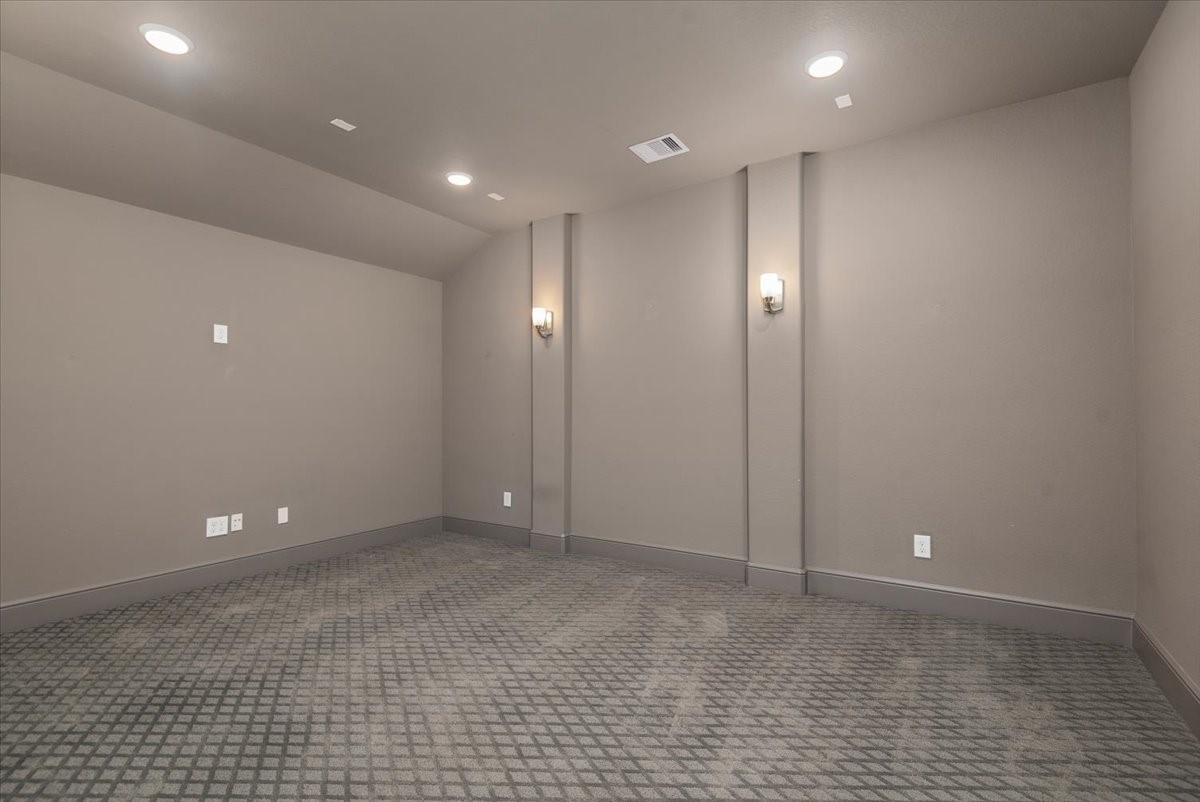 155 Rockwell Park Spring, TX 77389 - Photo 40 of 50 Transform your entertainment experience in this sleek, cozy media room, perfect for movie nights and immersive gaming.