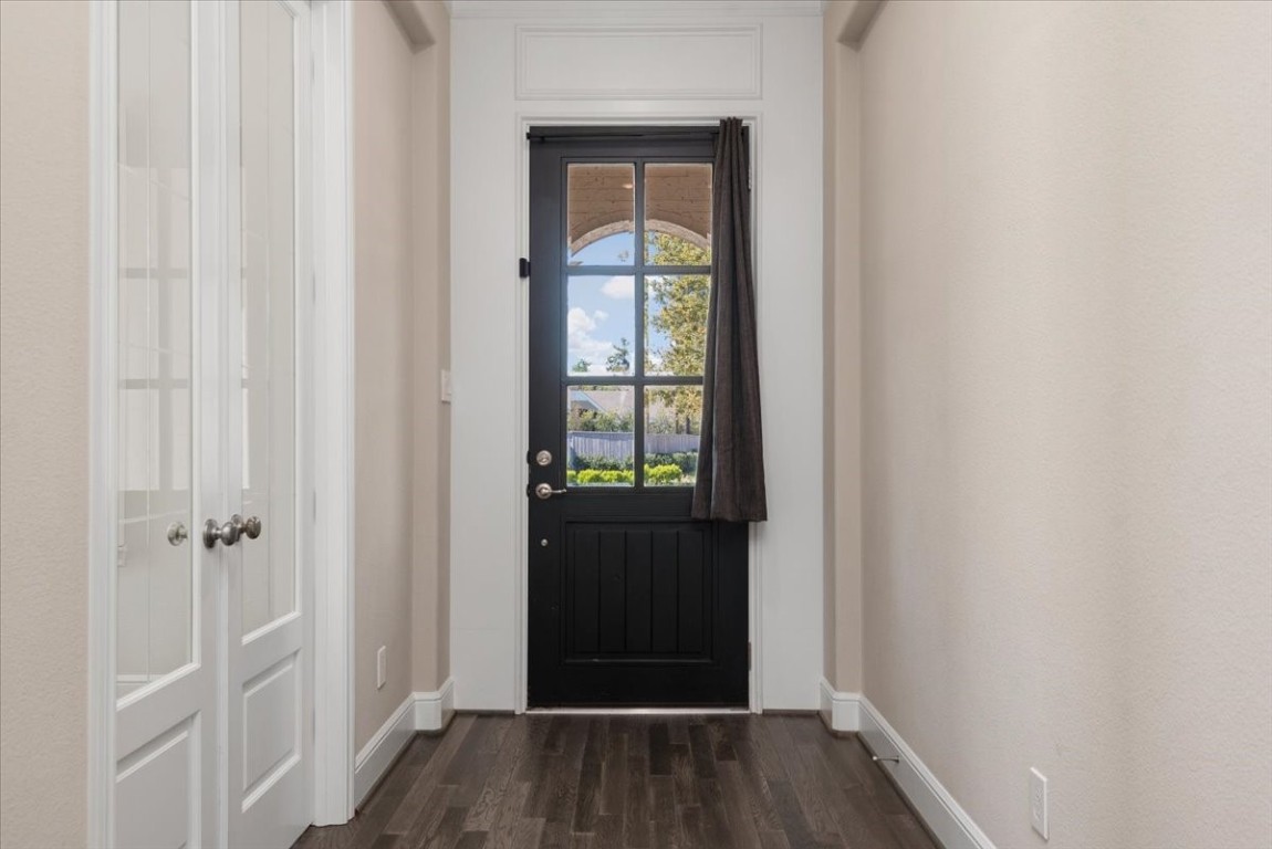 155 Rockwell Park Spring, TX 77389 - Photo 4 of 50 Bright hallway leading to an office/study with charming French doors, ideal for both productivity and relaxation.