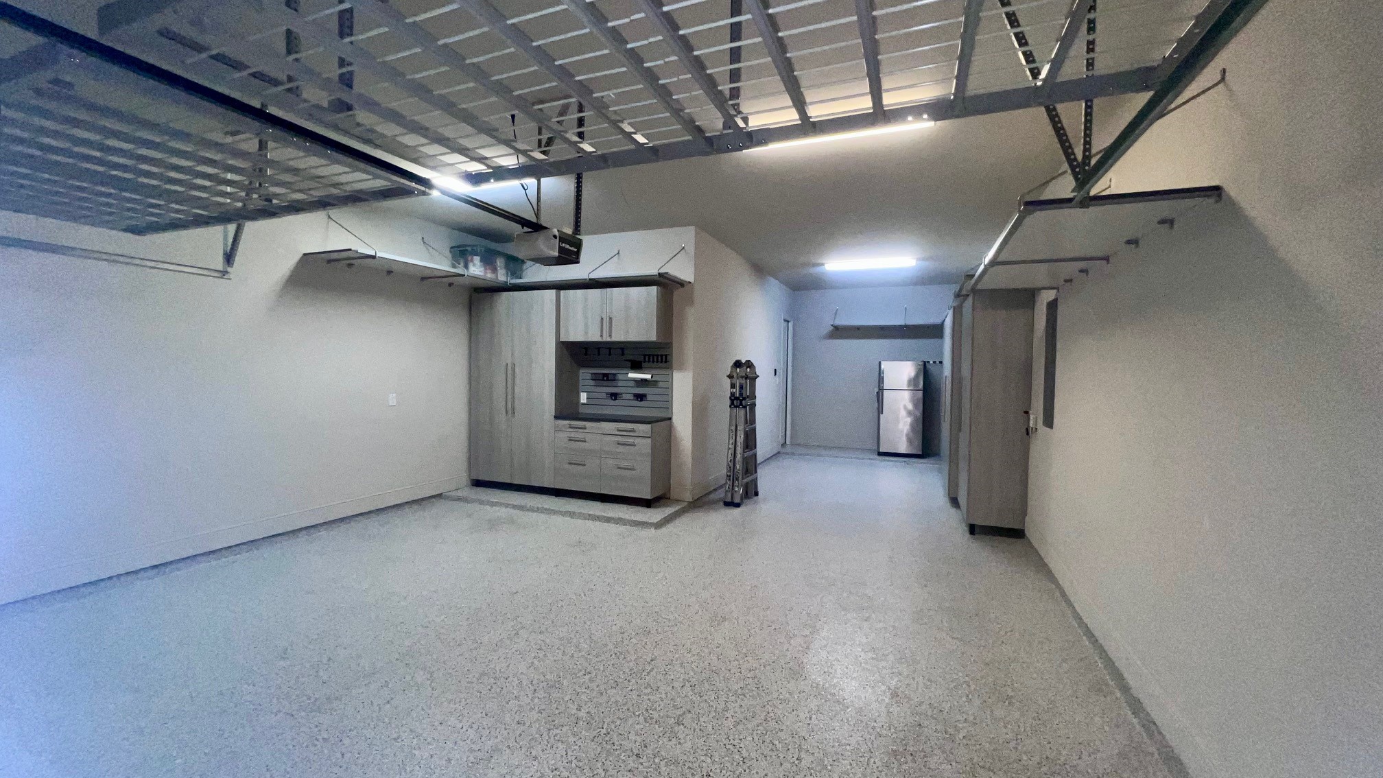 155 Rockwell Park Spring, TX 77389 - Photo 49 of 50 Transform your organization with this sleek garage featuring custom storage solutions, perfect for maximizing space and style.