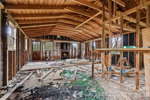 a view of a backyard with wooden deck