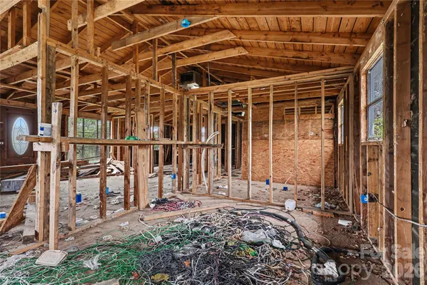 a view of a house with wooden floor and a window